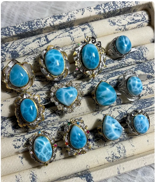 

Natural crystal larimar, Italian craftsmanship, inlaid in oversized rings, pendants, and bracelets.