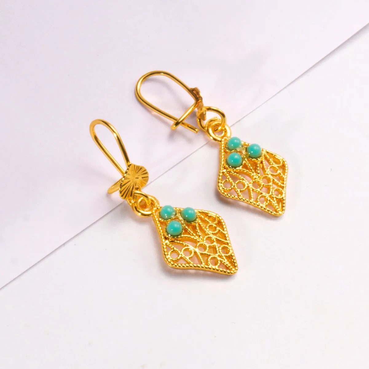 9999 gold Dubai Bohemian-style ear jewelry with high-end feel, African-style fringes and hollowed-out leaf-shaped earrings