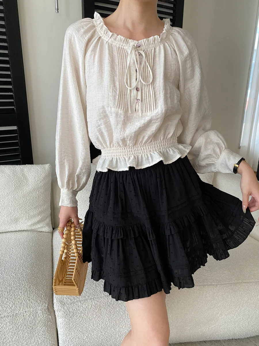 

Весенне-летняя женская повседневная однотонная рубашка с длинными рукавами, воротником-стойкой, рюшами по краю и завязками на талии.