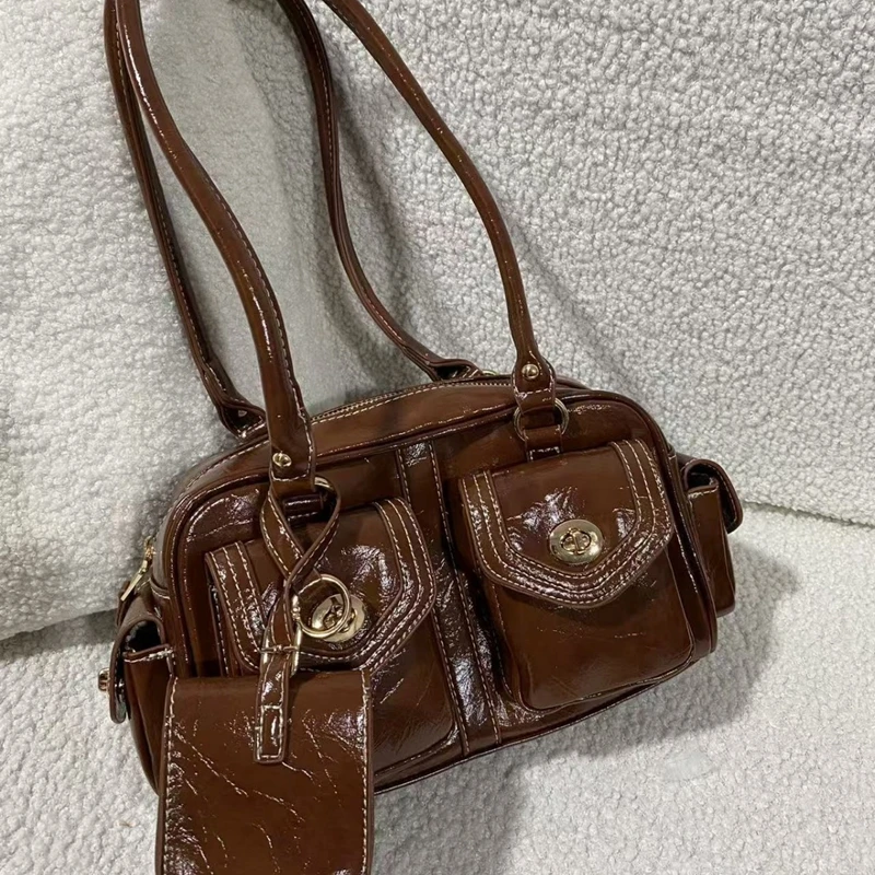 

Fall Winter 2026 New Style South Maple Versatile Boston Shoulder Bag Golden Impressions Pillow Bag for Commuting And Work