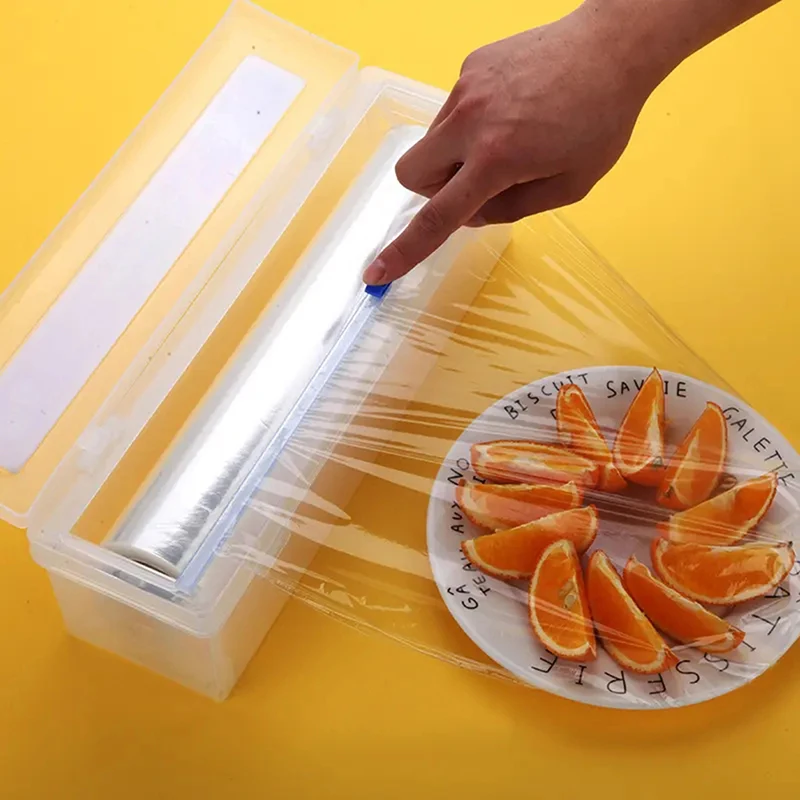 Dispenser per involucro di plastica e taglierina per pellicola per alimenti parte per taglierina per pellicola trasparente