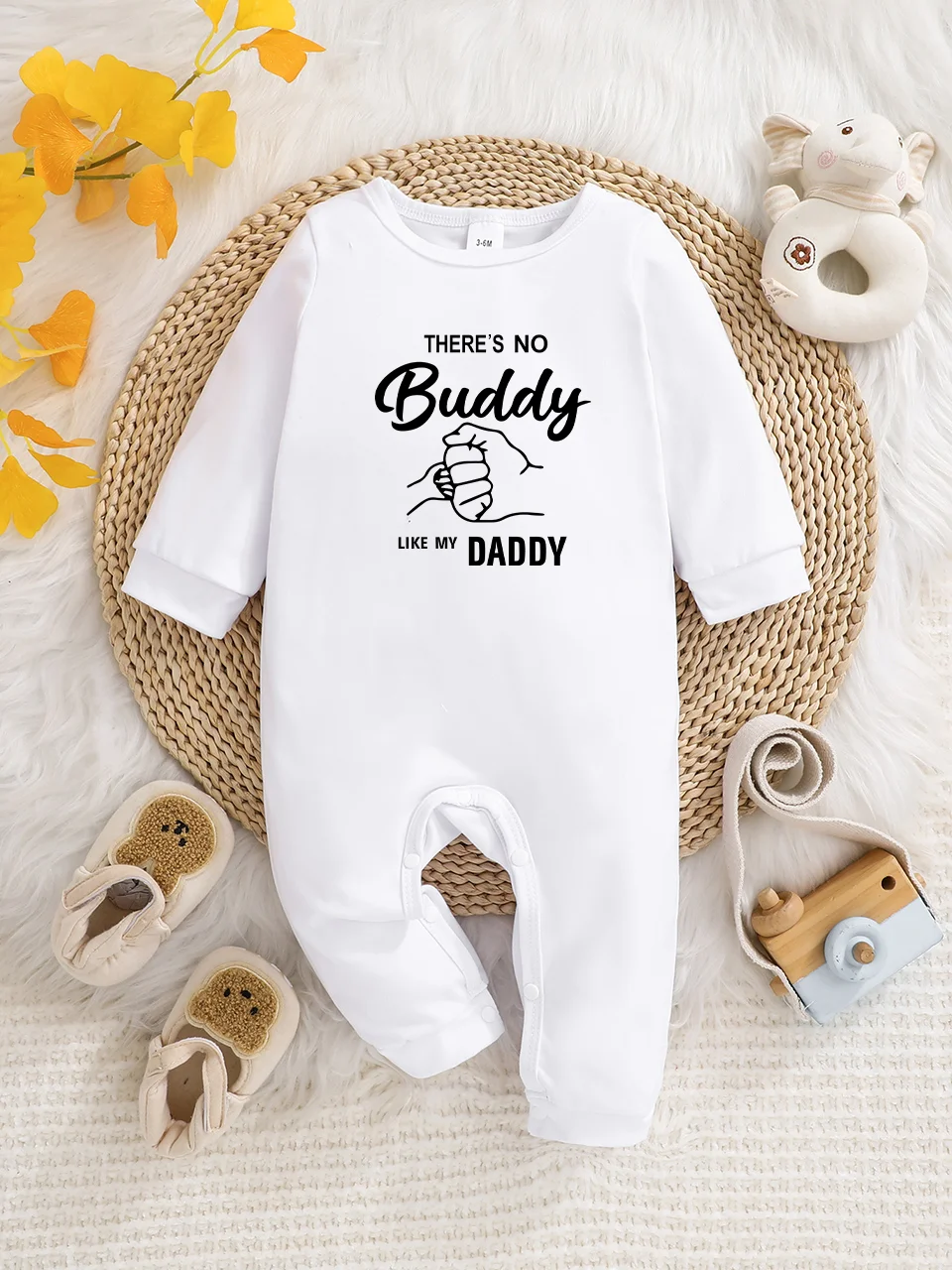 A baby long-sleeved onesie with interesting letter prints. It features a buttoned design for easy putting on and taking off, and