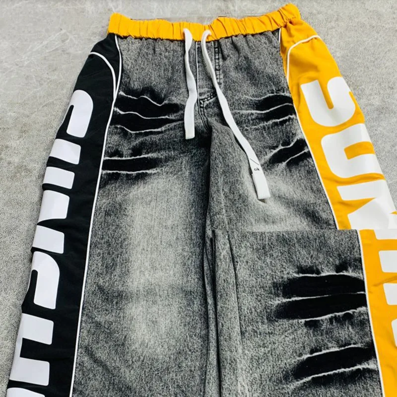 ANJY ฤดูใบไม้ร่วงใหม่ผู้หญิงกางเกงยีนส์ DENIM Patchwork ด้านข้างพิมพ์สายรัดเอวยางยืด Streetwear Casual Chic กางเกง A8764
