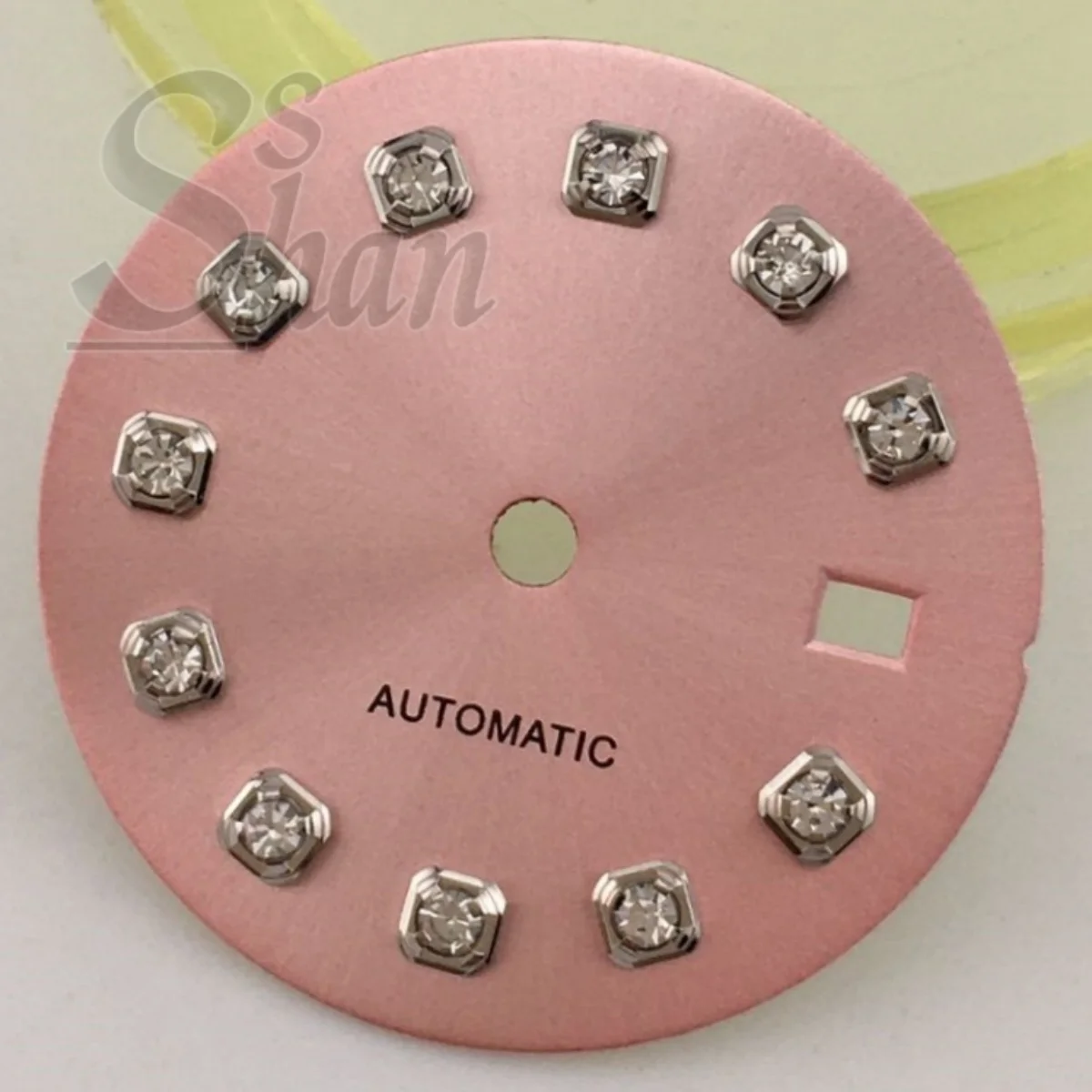 NH05 20.5mm dial with gold silver rose gold diamond indices is paired with a 26mm NH05 movement component a brown sunburst dial