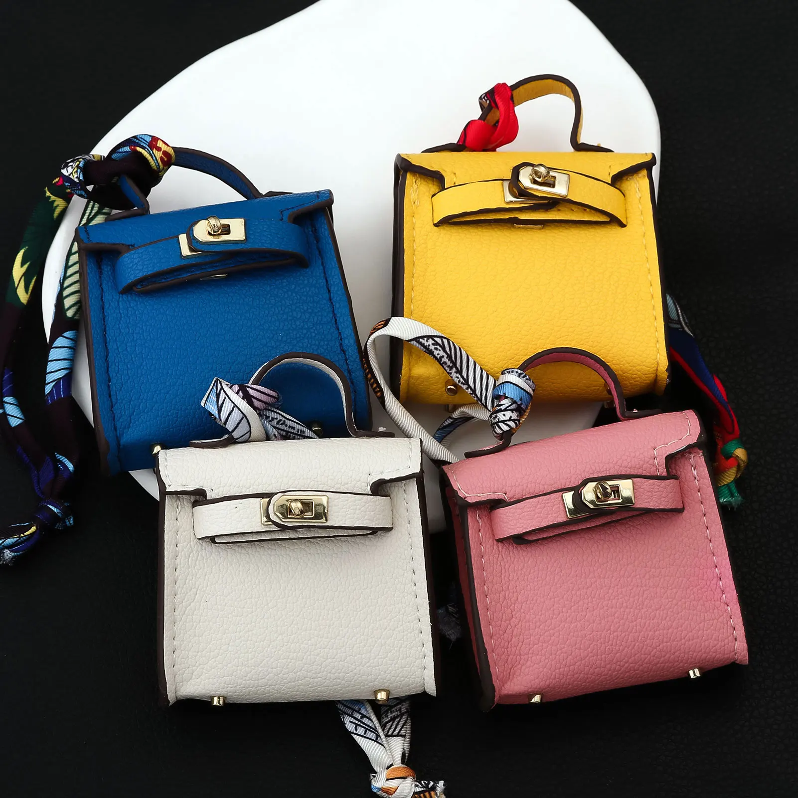 حقيبة صغيرة كيلي لأحمر الشفاه حقيبة سماعة الرأس حقيبة لطيفة شريط معلق حقيبة سلسلة مفاتيح ساحرة للنساء بلون سادة حقيبة أنيقة ملحقات هدية