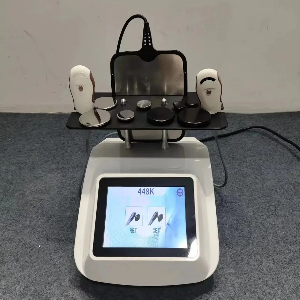 

Портативный аппарат для физиотерапии Tecar Therapy Ret Cet с радиочастотной терапией 448K для лифтинга лица и обезболивания, модель 2026 года, белый цвет