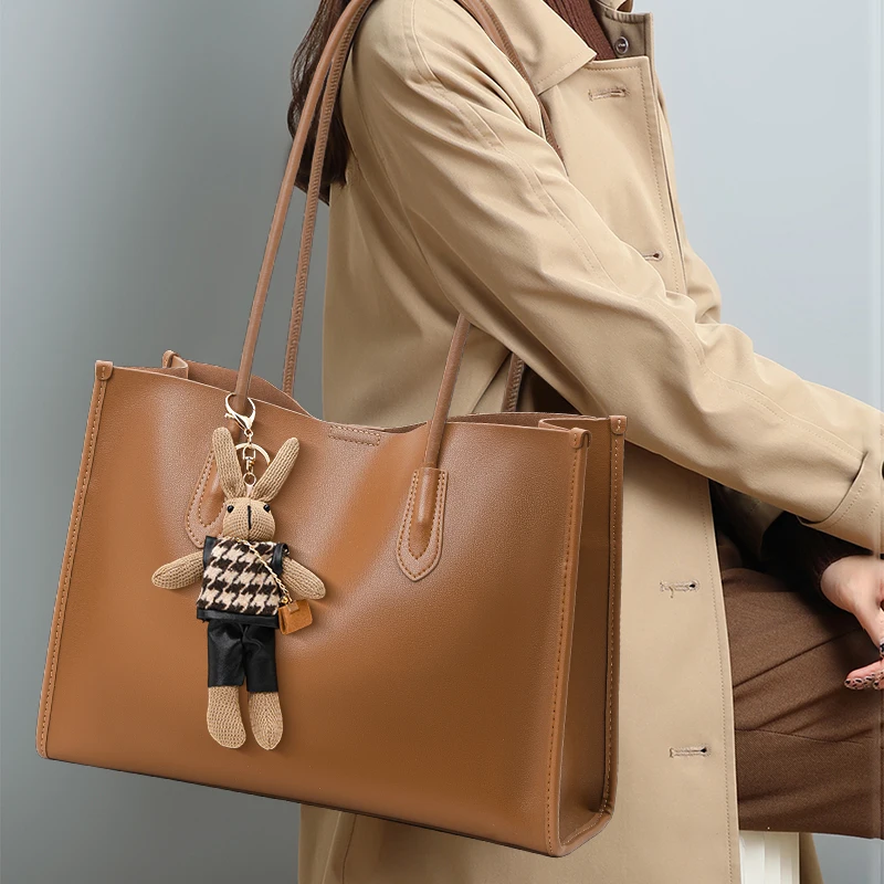 

Leather Tote Bag with Bunny Charm: Spacious Design
