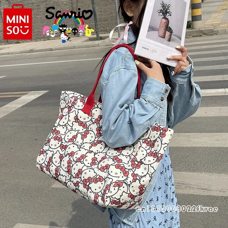 กระเป๋าถือผู้หญิง MiniSO HelloKitty ใหม่กระเป๋าช้อปปิ้งของของผู้หญิงความจุขนาดใหญ่การ์ตูนกระเป๋าสะพายไหล่ที่ทันสมัยของของผู้หญิงที่มีคุณภาพสูง