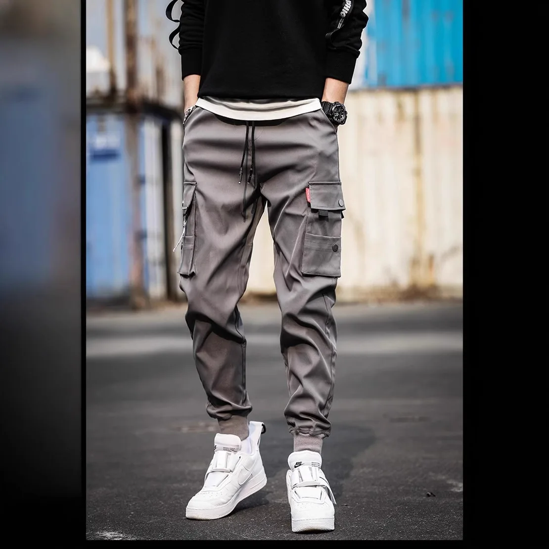 

Новые модные однотонные брюки 2025 года, мужские брюки-карго с несколькими карманами и карманами, свободные повседневные уличные брюки, мужские рабочие брюки оверсайз