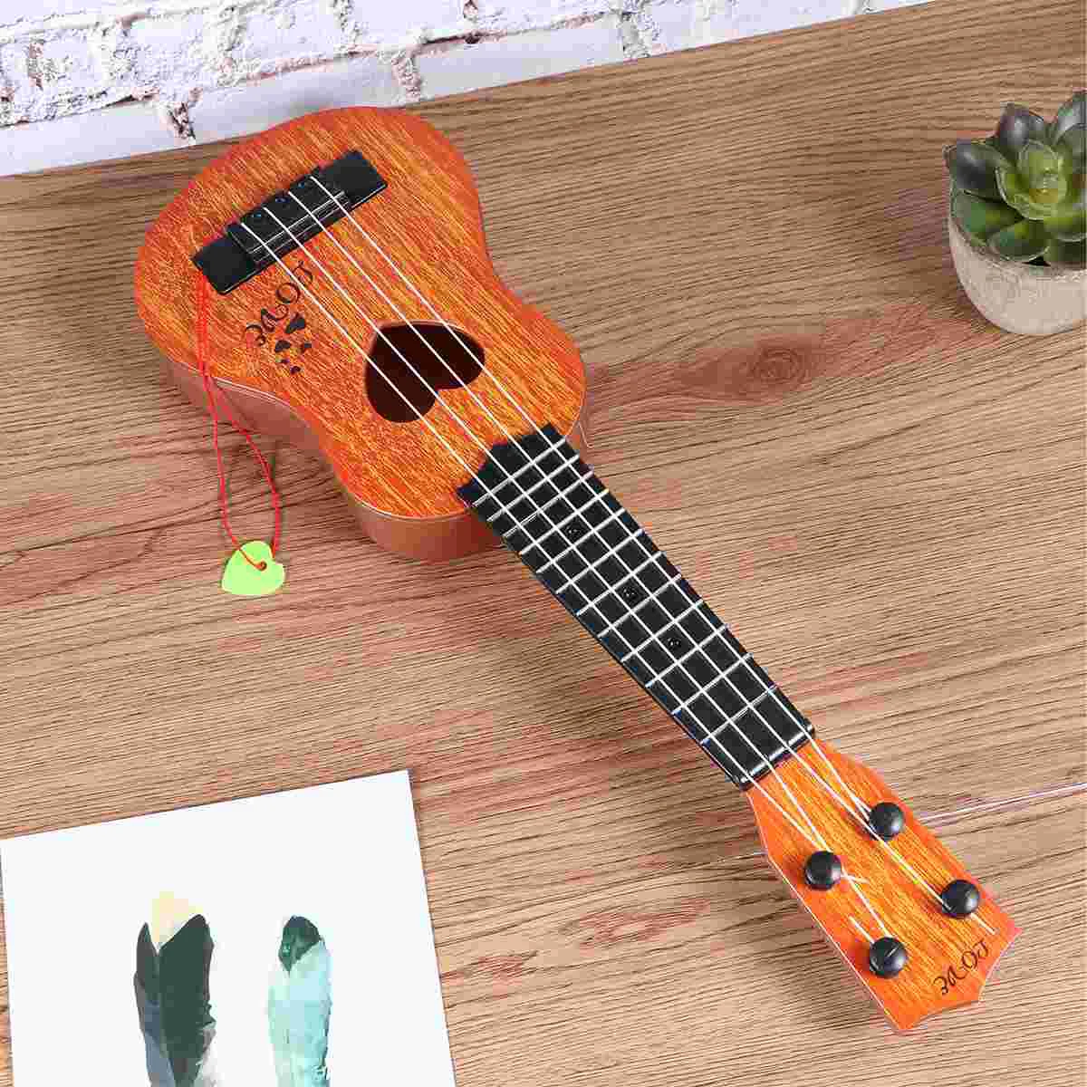 

Kids Ukulele Guitar- 4 Strings Heart Hollow Ukulele Early Educational Learning Musical Instrument Nylon Strings Adjustable