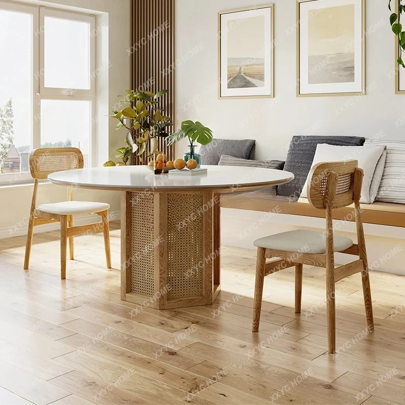 A  Wabi Sansan wind braided rattan solid wood dining table pure white rock slab countertop Nordic dining table