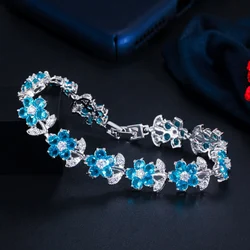 ThreeGraces Beautiful Light Blue Cubic Zirconia Flower Shape Link Chain Bracelet for Women Fashion Daily Party Jewelry BR301