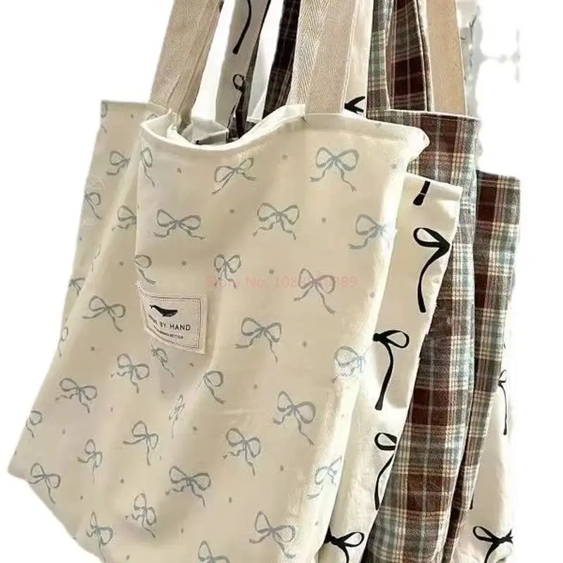 حقيبة كتف جديدة للطالبات النسخة الكورية، حقيبة حمل ذات سعة كبيرة للتنقل، حقيبة يد ربطة القوس فيونكة، حقيبة تسوق