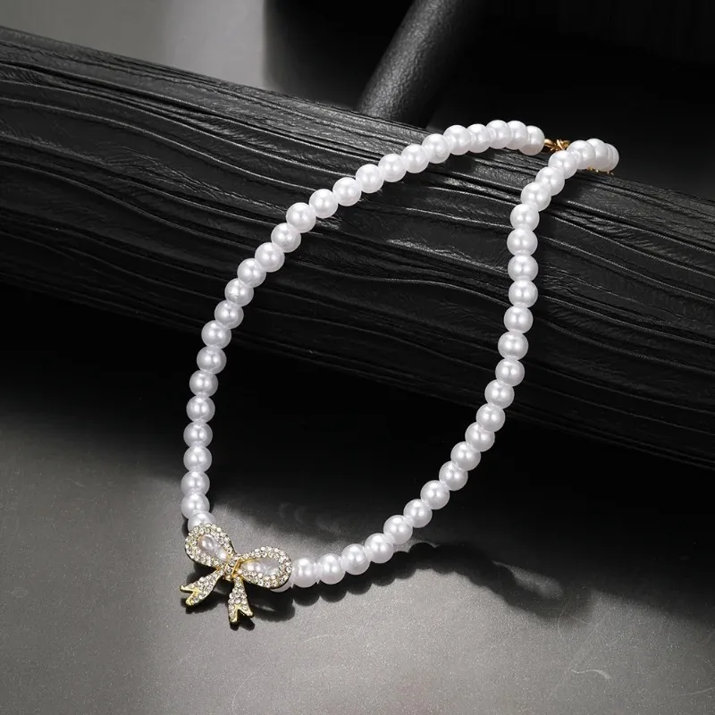

Simple temperament, versatile bow, high-end feel, pearl necklace, women's collarbone chain, necklace accessories