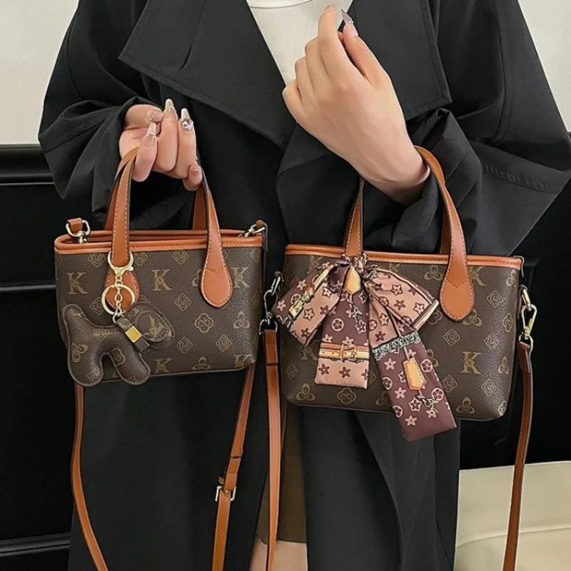 おしゃれなミニマリストデザインのママバッグ、エレガントなレザー製クロスボディバッグ、女性用スタイリッシュで大容量のトートバッグ