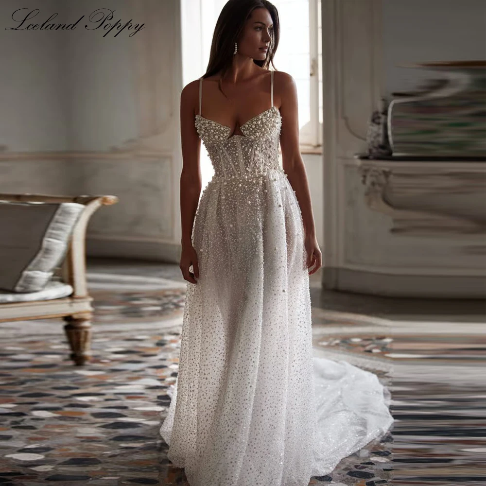 

Lceland Poppy Sexy A Line Illusion Tulle Wedding Dresses Sleeveless Pearls Beaded Bridal Gowns with Court Train