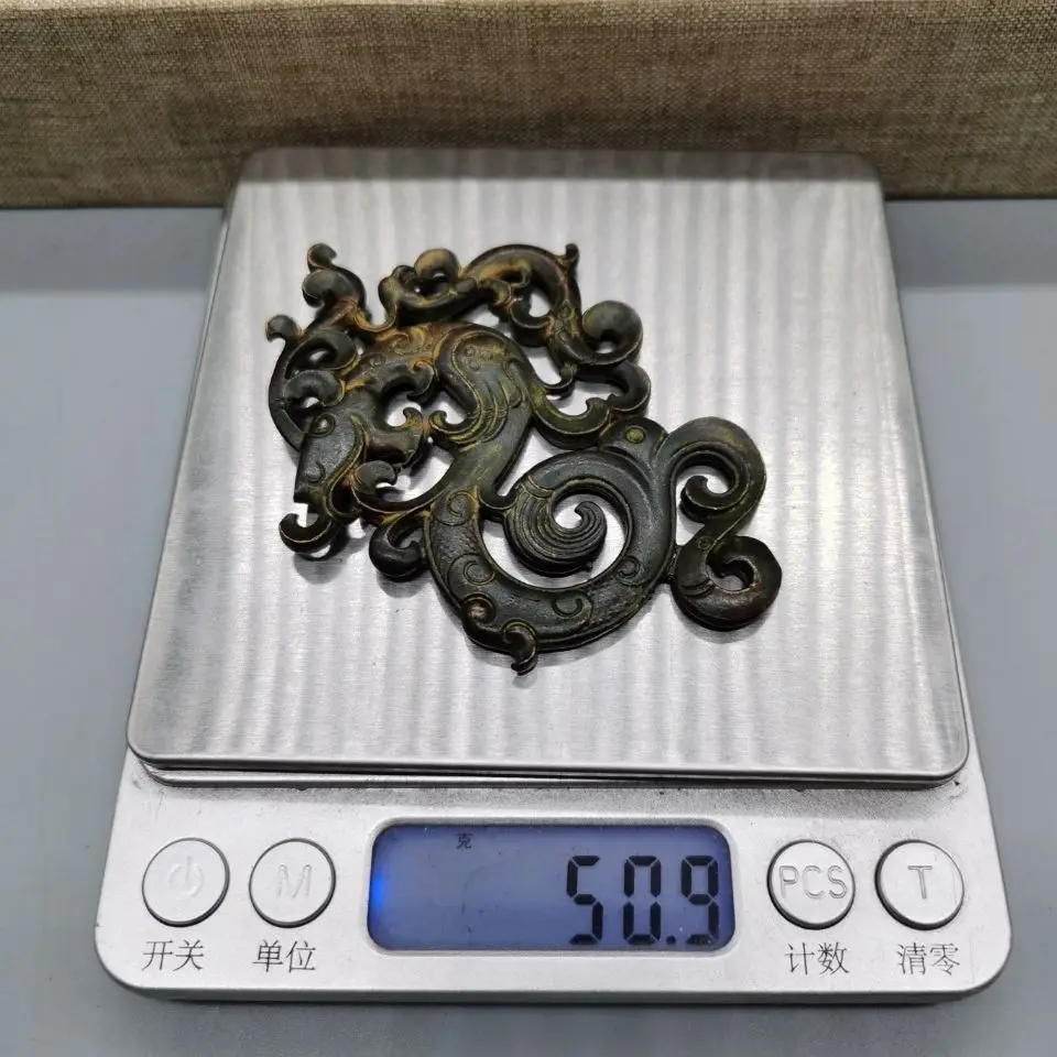 Antique old Tibetan bronze ware hollowed out antique dragon double-sided brand pendant, small ornament, good pulp
