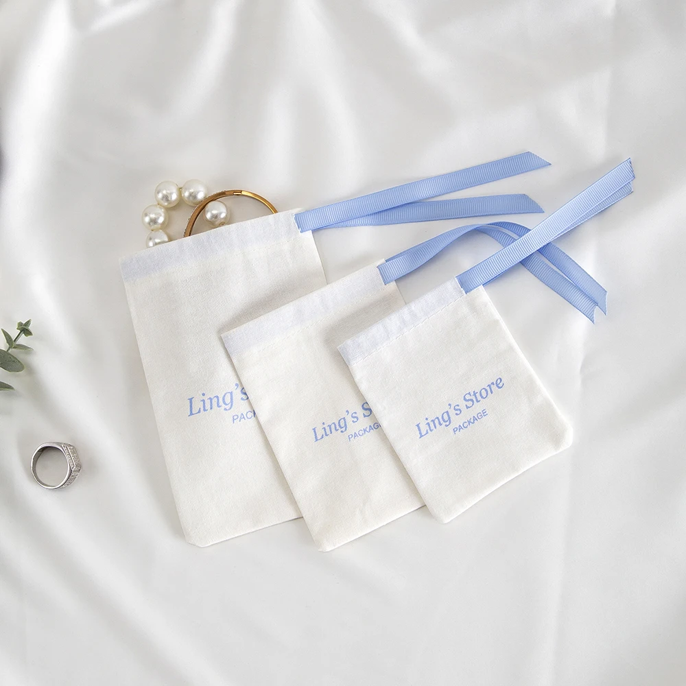100Pcs Custom Logo White Cotton Jewelry Muslin Bag Canvas Ribbon Pouch For Ring Earrings Watch Sunglasses Headset Gift Organizer view 4
