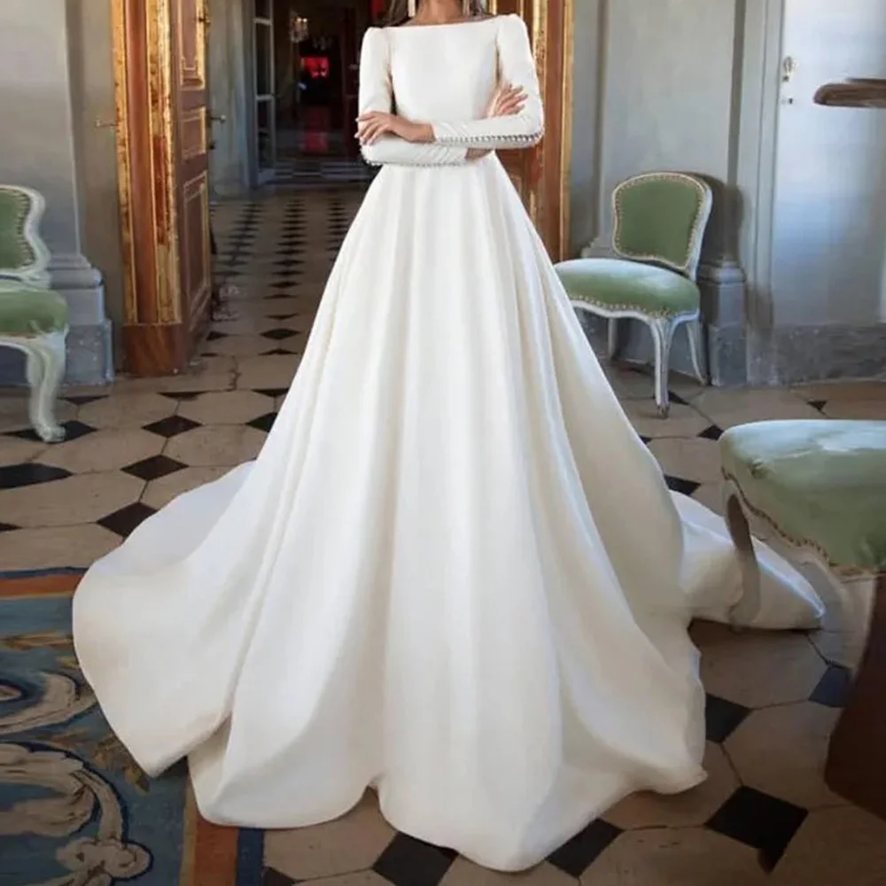 

Elegant Solid Color Satin Buttons Back Wedding Dress Classic Crew neck Floor Length A-Line Sweep Train Pleats Long Sleeves 2024