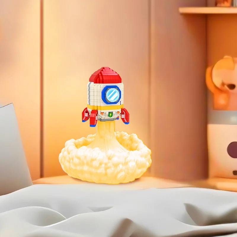 Set di blocchi di costruzione con razzo spaziale Modello di cartone animato aerospaziale con luce notturna assemblato giocattolo da costruzione per regalo di compleanno per ragazzo