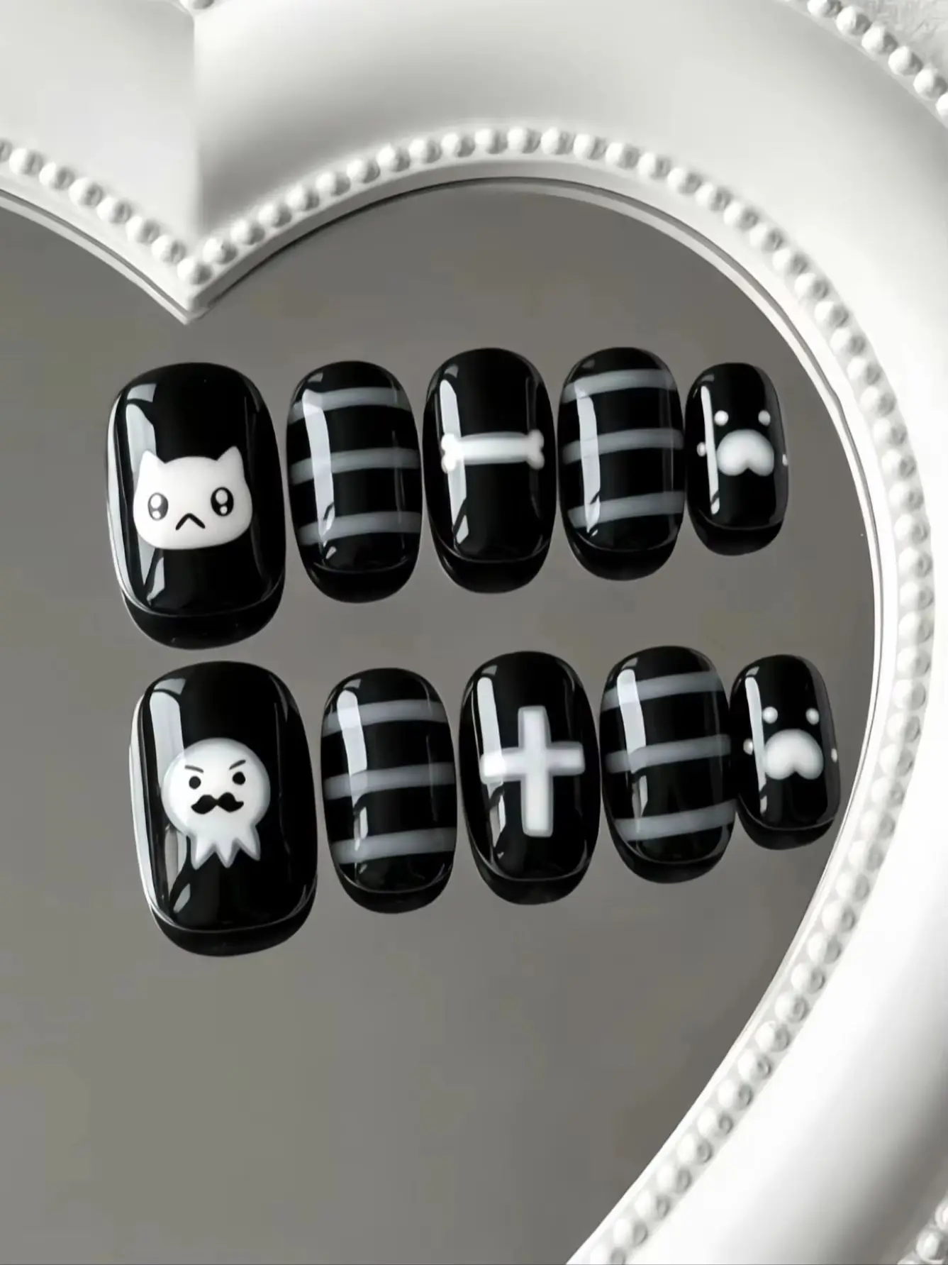 10-Piece Set of Black and White Cartoon Cat Ghost Nail Art, Pure Black Glossy Base Color with Gray and White Horizontal Stripes, Hand-Drawn Cute Little White Cat, Bearded Ghost, Bone and Cross Elements, Cartoon Dark Style, Cute and Cool