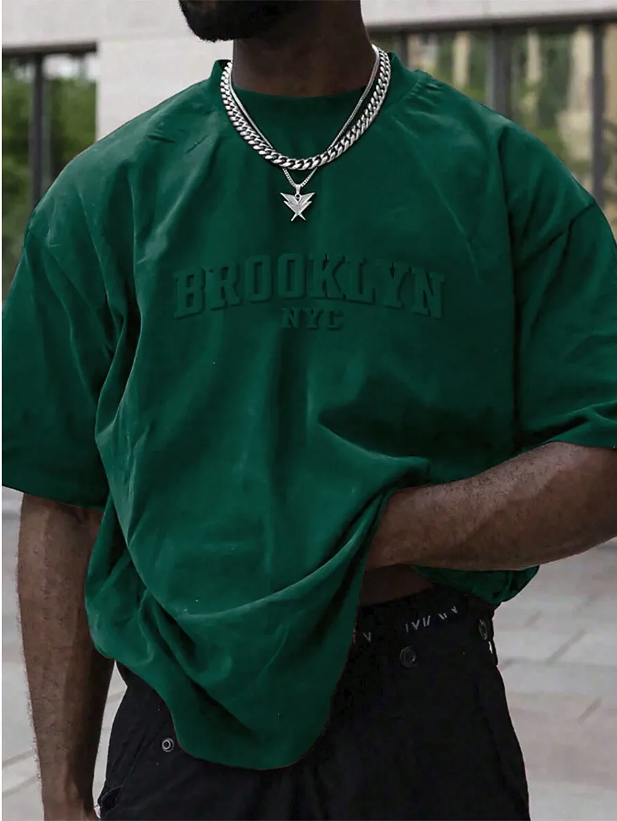 Men's Oversized Short Sleeve T-Shirt with Embossed City Text Design
