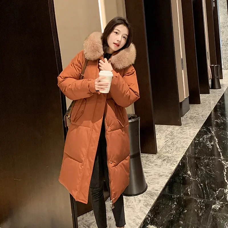 Abrigo coreano de algodón para mujer, Parkas de invierno 2025, nueva chaqueta acolchada de algodón larga y cálida, prendas de vestir con capucha, Top de moda para mujer