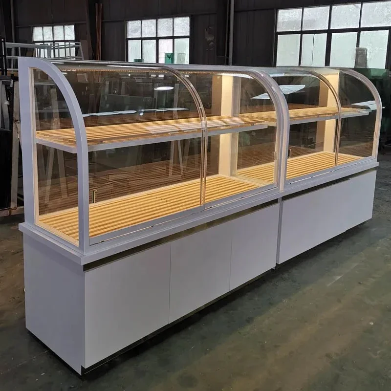 Bread cabinet new high-end titanium-plated stainless steel arc-shaped Zhongdao cake model cabinet glass display