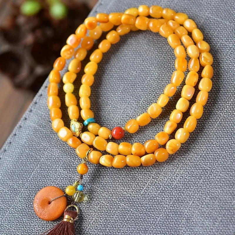 Natural Russian bracelet 5mm featuring three strands of beads in a chicken oil yellow hue made from raw amber