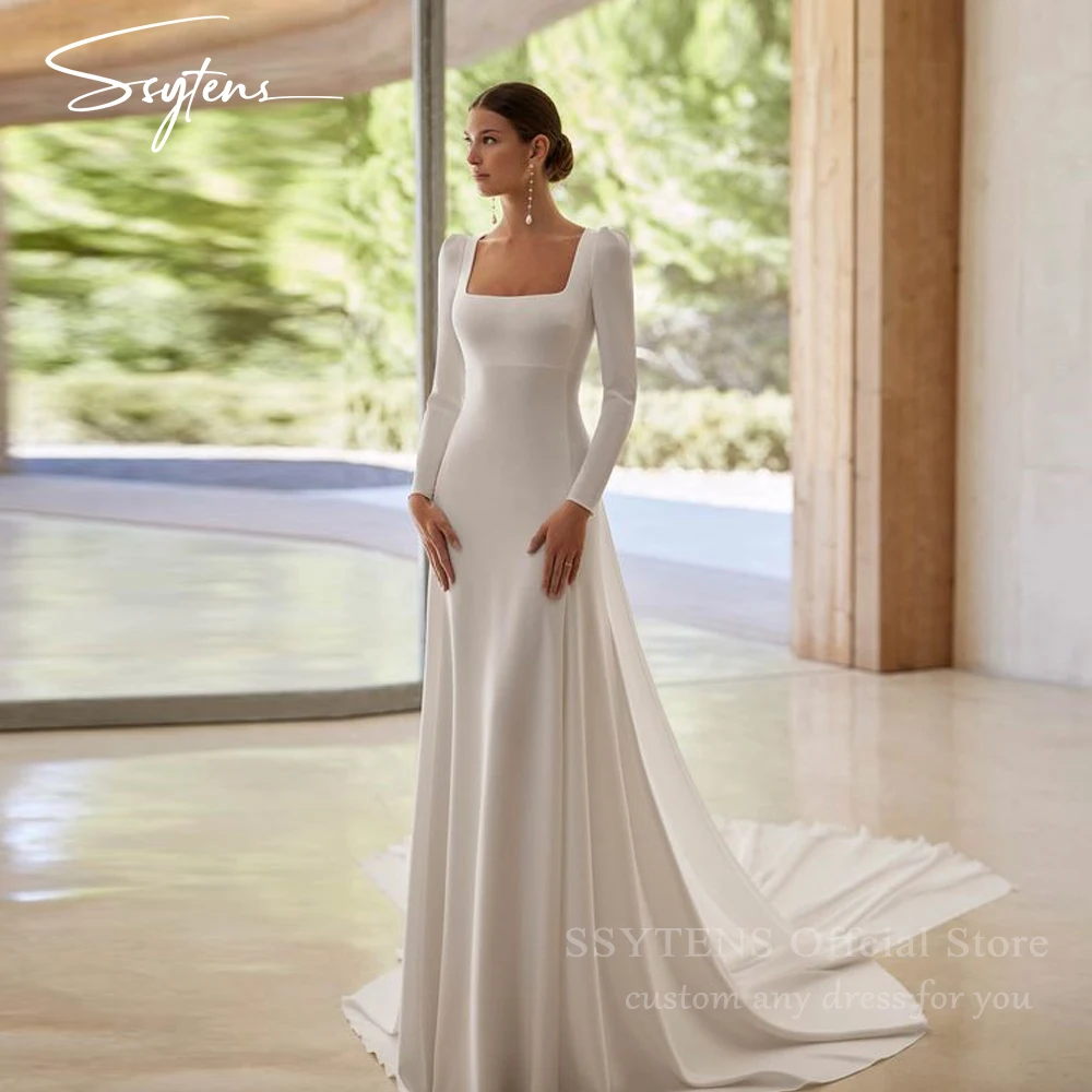 long sleeve wedding dress with low back Tulle and Crepe The bateau neckline and long sleeve add a touch of sophistication Modest Wedding Dress with Lace