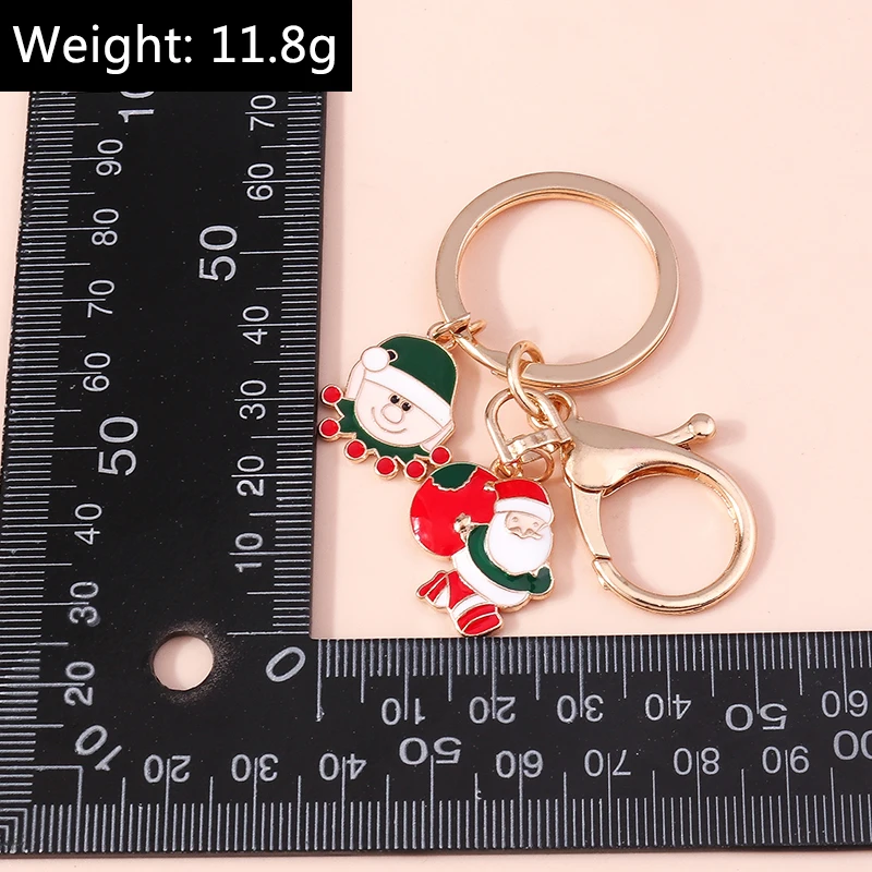 Modischer Weihnachts-Schlüsselanhänger aus Emaille mit Weihnachtsbaum-, Schneemann-, Weihnachtsmann- und Hirsch-Anhängern für Damen, Herren und Autoschlüssel. – Detail 35