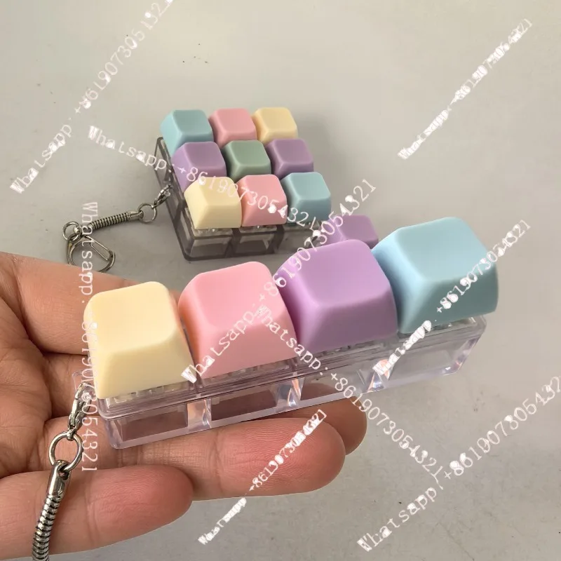 

One-font four-button press keyboard toy shaft tester decompress keychain
