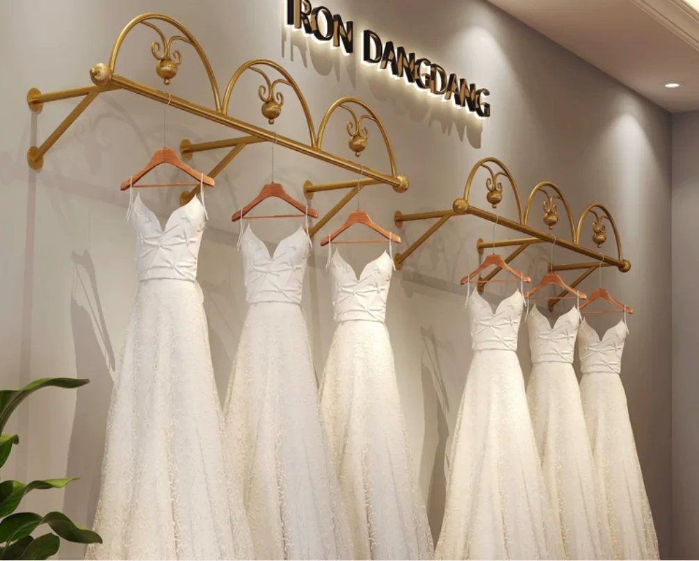 

Clothing store hangers, golden wedding dress display racks, wall mounted formal dress display racks, wedding dress display racks