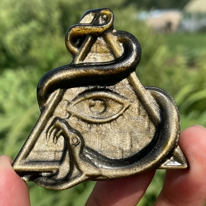 A handcrafted Bohemian snake carving—polished obsidian eye, a loose play stone suitable for jewelry making