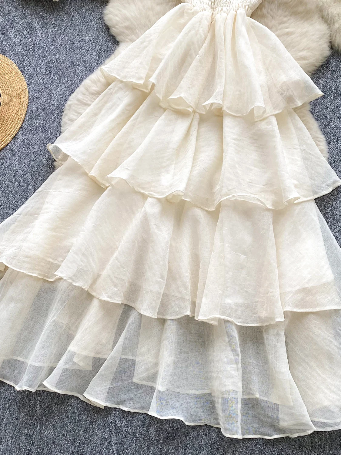 Vestido Midi E de Cintura Alta em Linha A para Mulheres Verão 2025 Sem Mangas Estilo de Saia Torta Versão Coreana para...