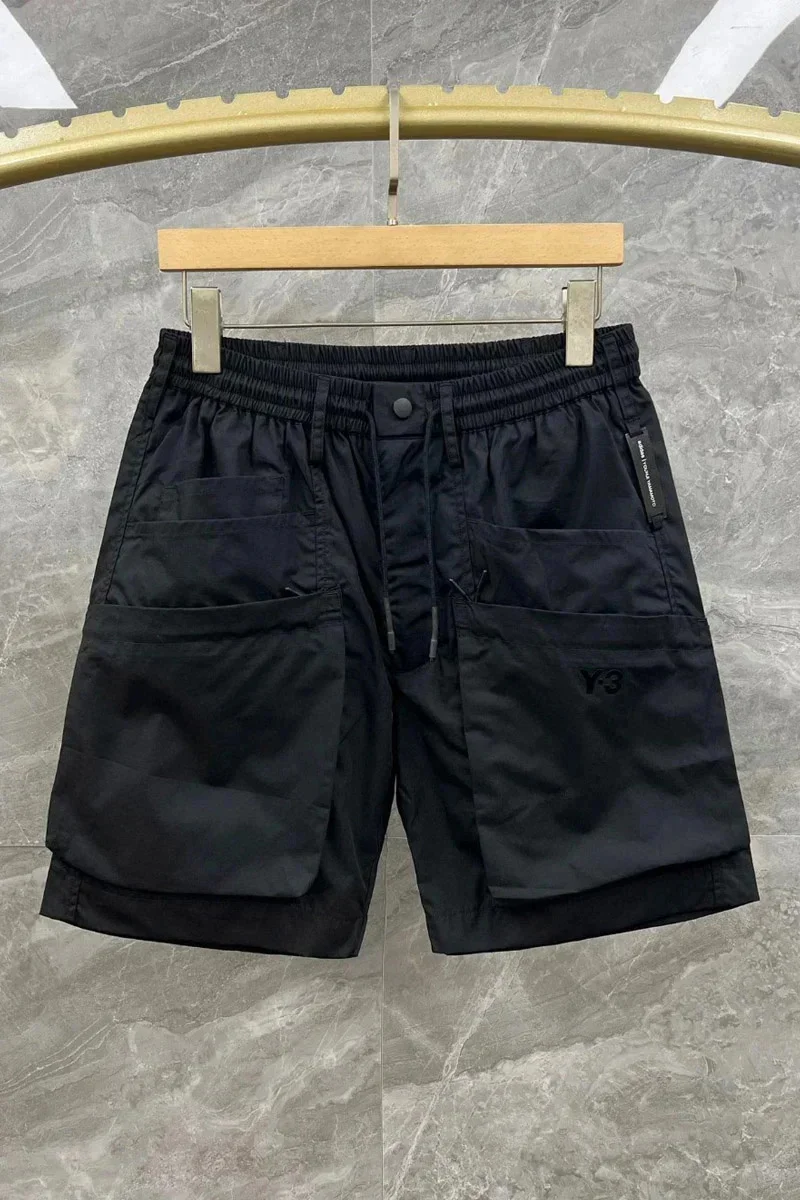 Pantalones cortos negros coreanos para hombre, ropa de calle de verano con múltiples bolsillos, estilo Safari, deportivos, informales, versátiles