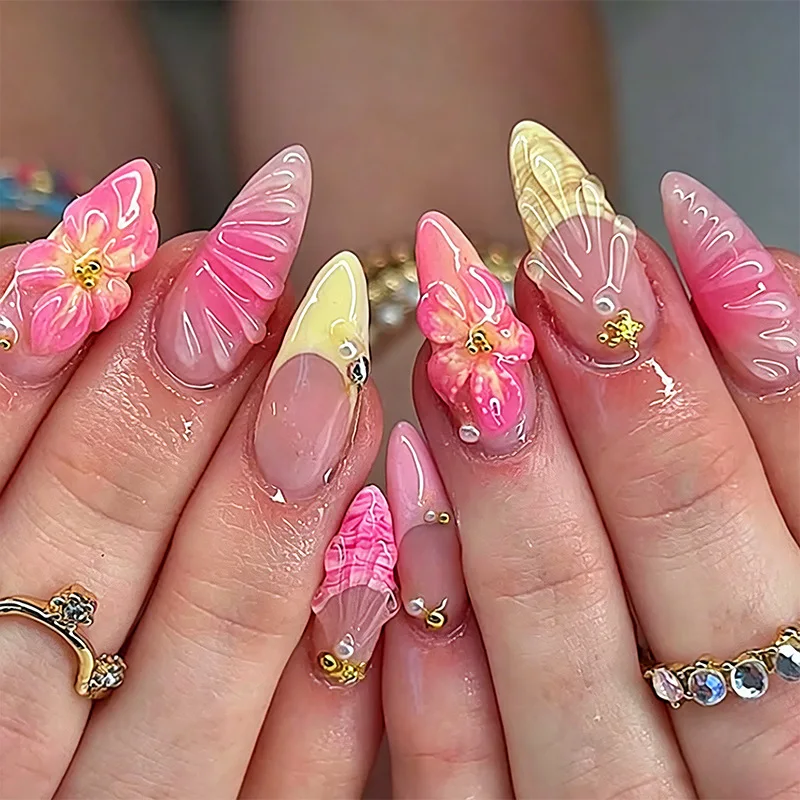 

Almond-shaped press-on nails, summer sweet pink with 3D floral, shell, and starfish motifs, featuring rhinestone accents.