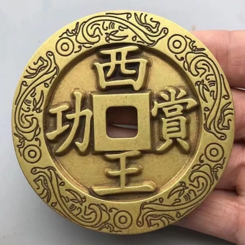 Brass heirloom with engraved floral patterns, collectible coin, antique craft item
