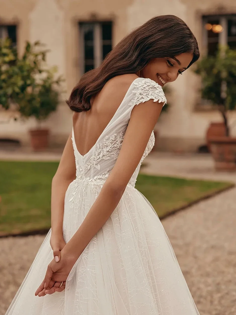 Eleganti abiti da sposa per le donne Sexy abito da sposa Appliques di pizzo Backless senza maniche profondo scollo a v Vintage Robe Vestidos De Novia