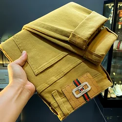 High-end affordable luxury jeans for men 2024 new autumn winter slim fit stretch ankle-tied trendy fashion yellow denim trousers