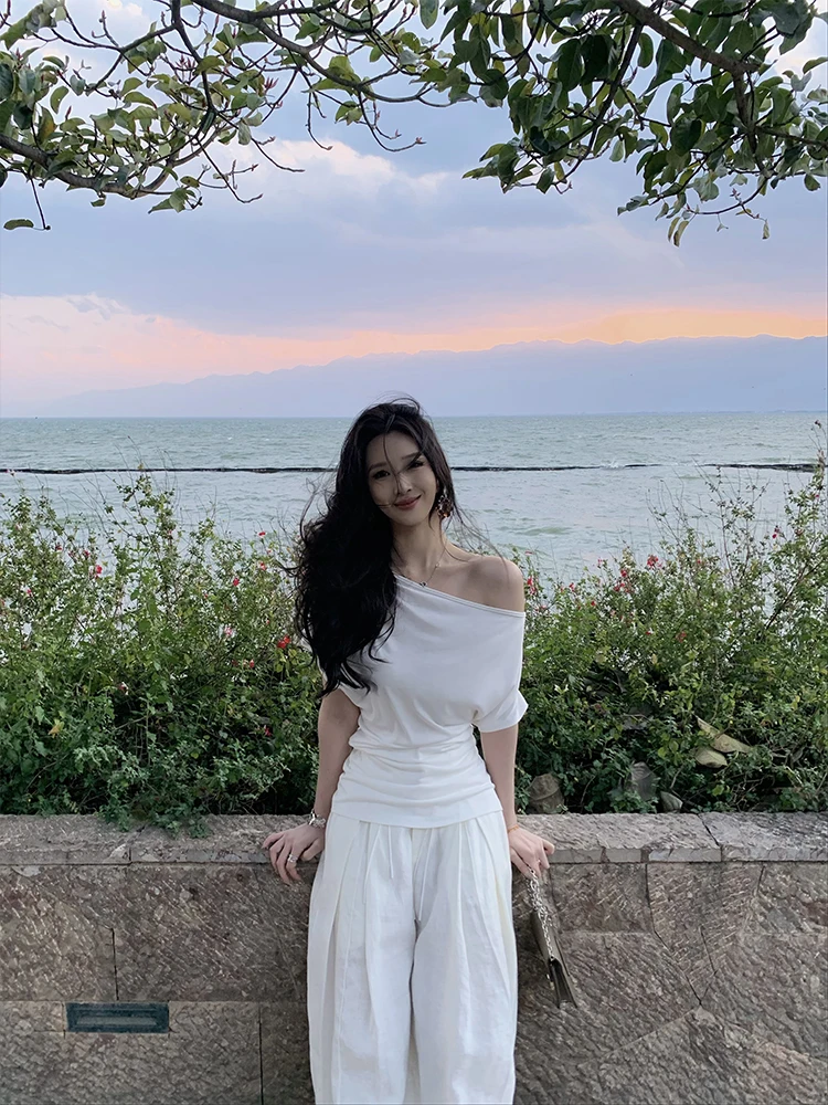 

Женский летний топ с завышенной талией, облегающий, однотонный, с открытыми плечами, асимметричным краем и оригинальным дизайном, повседневный