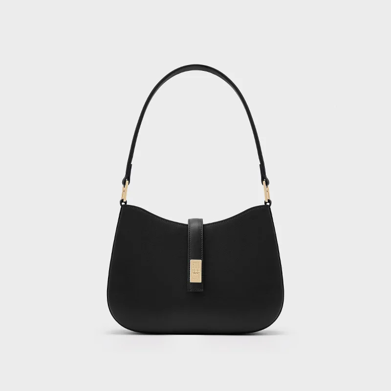 

The Crescent Moon Bag. Defined by its chic curve & premium leather. A stylish, versatile shoulder/underarm carry.