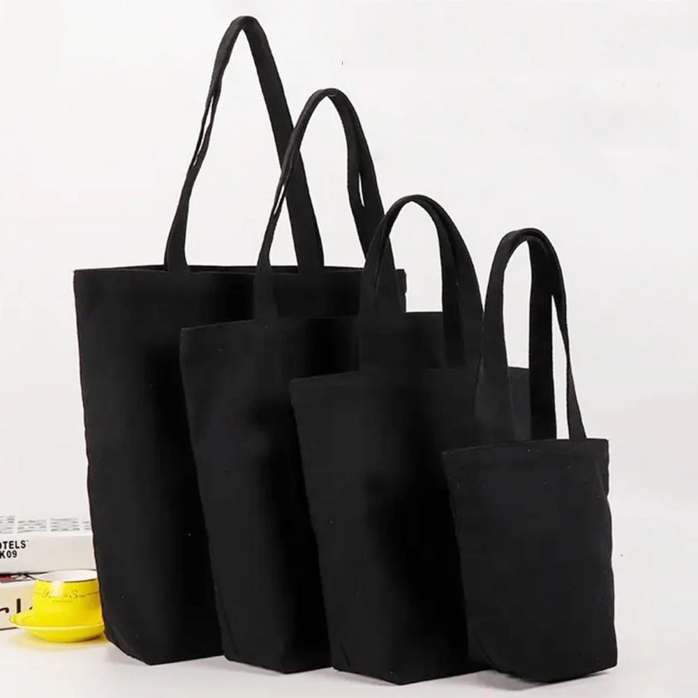 Bolso de mano de lona negra para estudiante, bolsa de algodón de un solo hombro, bolsa de almacenamiento de compras grande, bolsa de cosméticos de