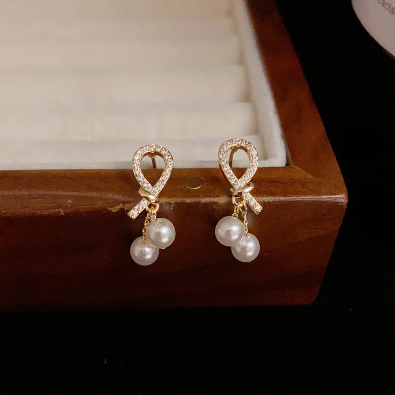 Korean Style Micro Inlaid Zircon Knot Pearl Light Luxury Style Minimalist Earrings for Women Jewelry Weddings Gifts.