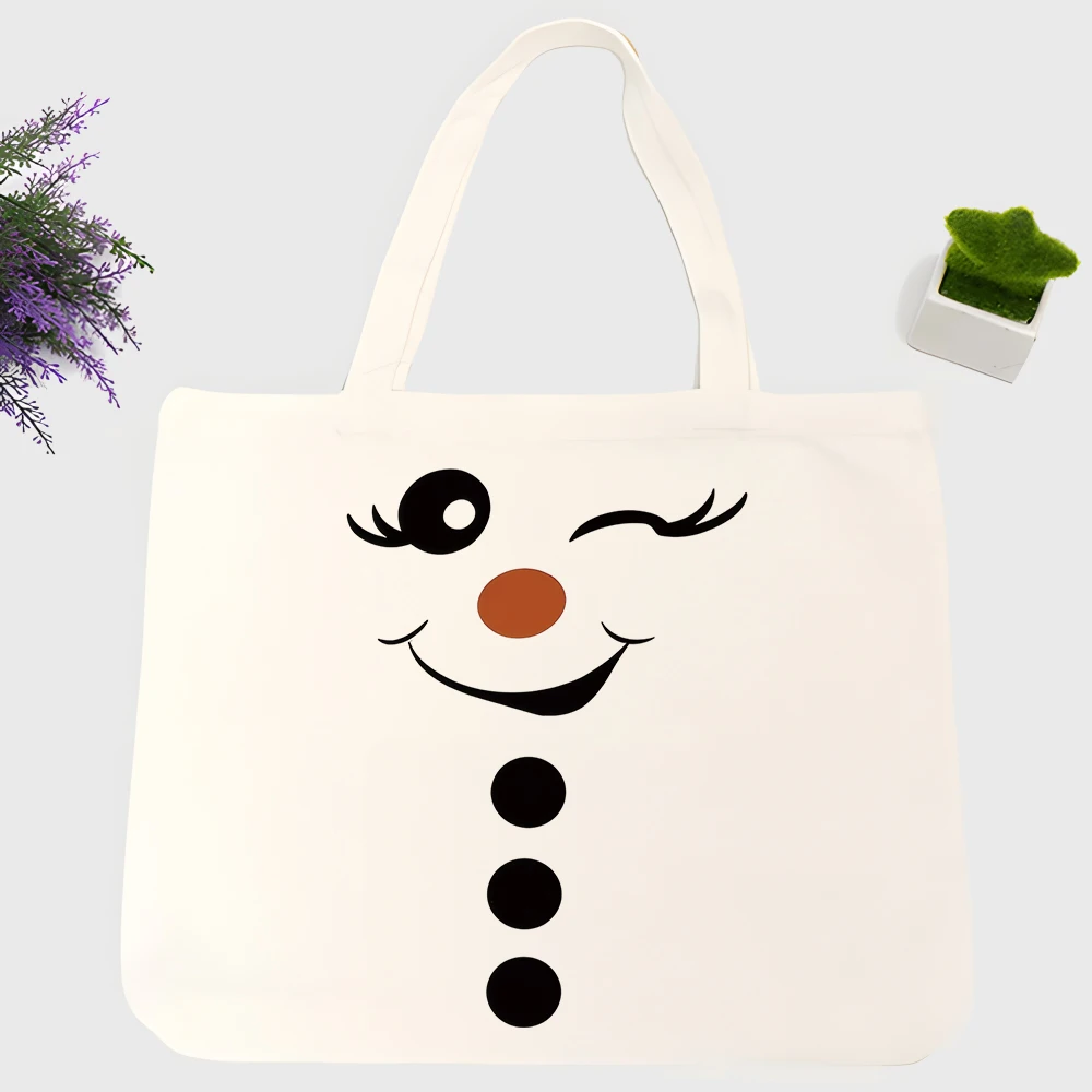 Women's snowman face graphic canvas tote bag, casual style for daily shopping and winter outings