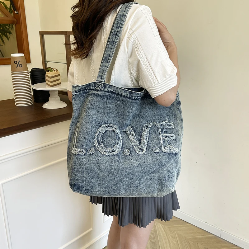 女性用デニムキャンバス大容量スクールバッグダメージ加工刺繍ショッピングバッグ装飾ストラップカジュアルデイリーショルダーバッグ2026