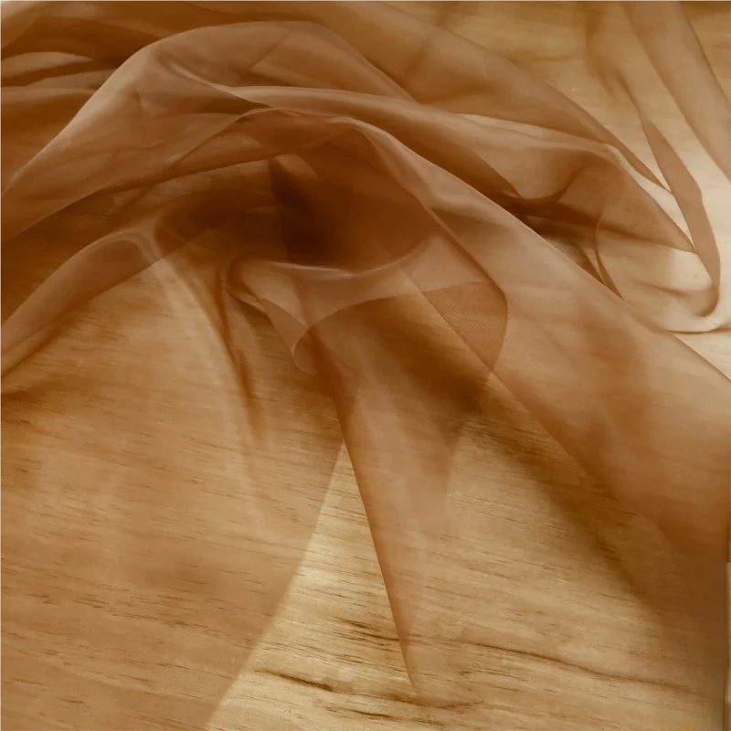 

Colored basic transparent organza light soft and smooth is a designer fabric for wedding gowns evening handcrafted clothing