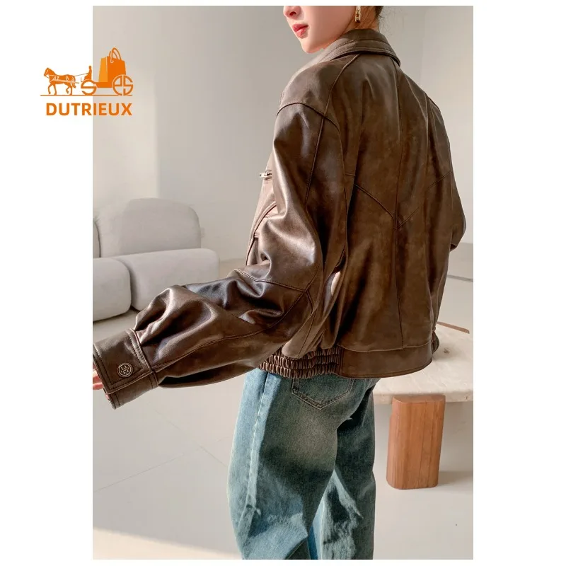 Nieuwe winter dames bruine losse korte leren jas, 100% echte schapenvacht, mode elegante motorfiets leren jas dames