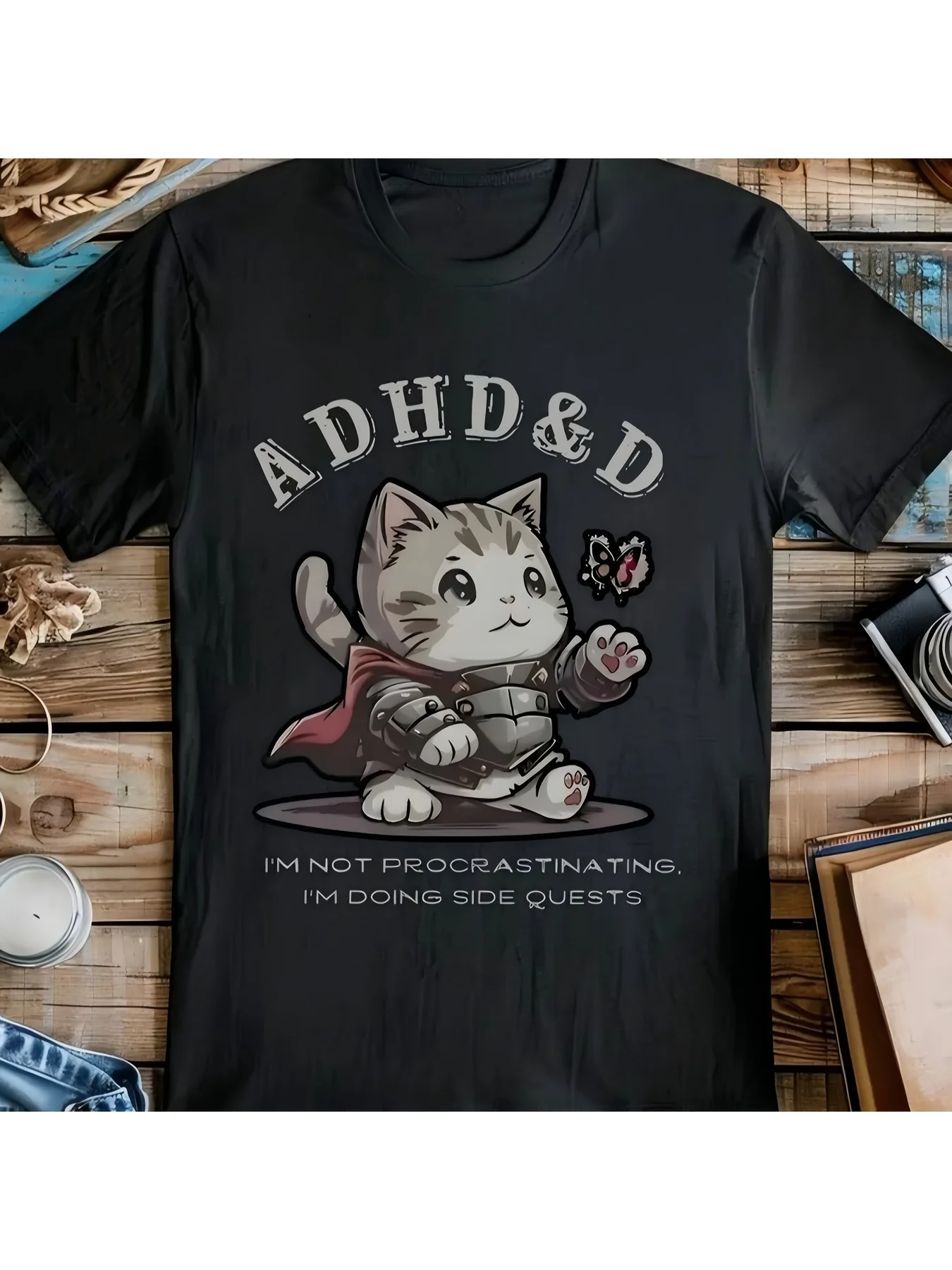 

Black T-shirt, kitten with a helmet and ADHD with text, with a