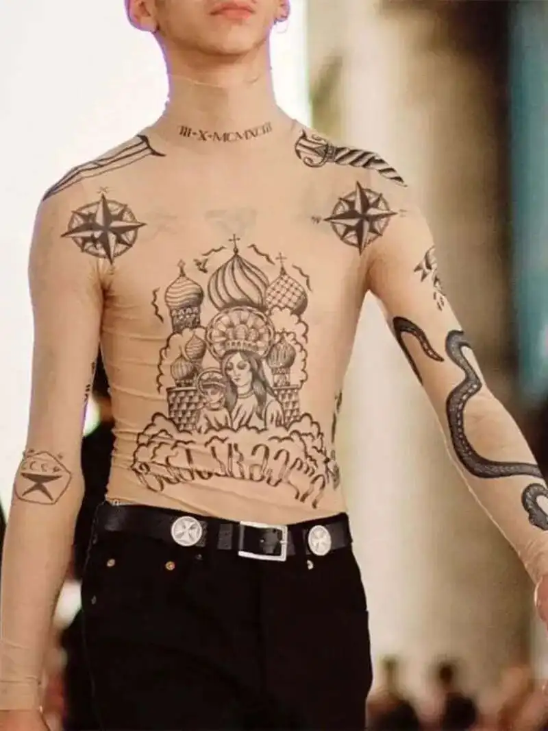 2025 الخريف جديد أزياء المرأة Basal أعلى آلهة الوشم طباعة طويلة الأكمام عالية ضيق طوق عارية اللون شبكة الغزل مثير تي شيرت B666